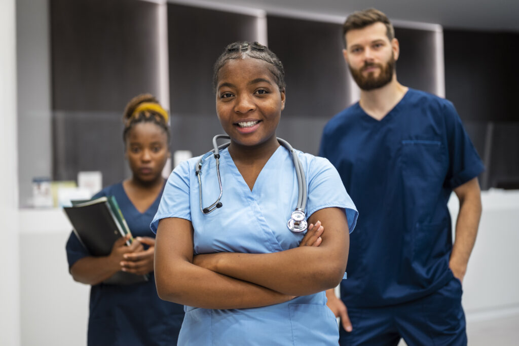 three certified nursing assistants smiling
