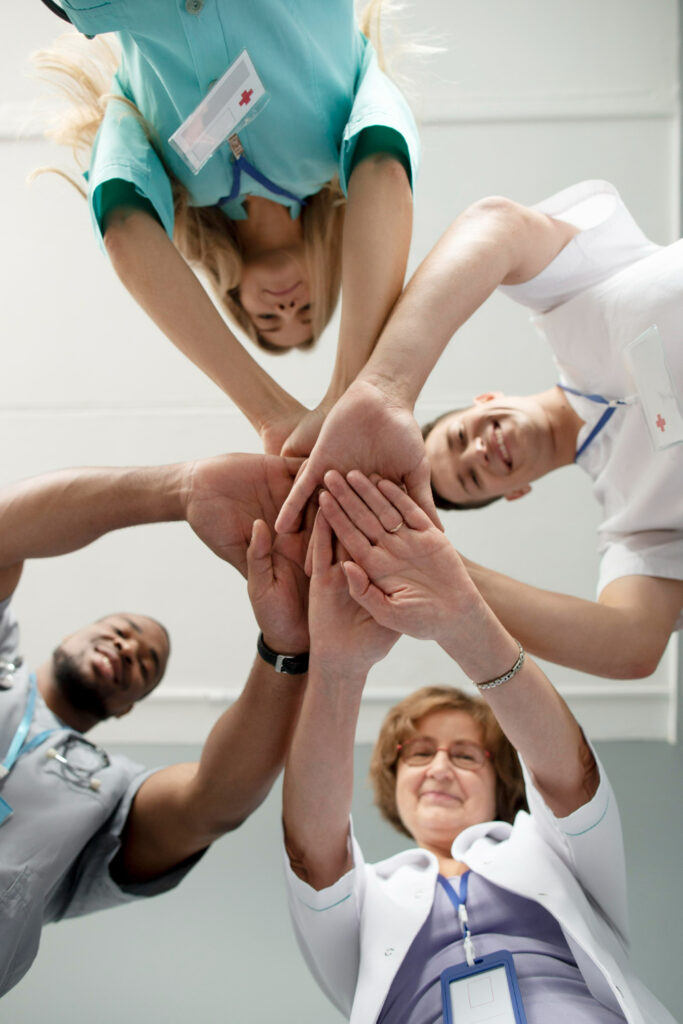 4 Healthcare workers in a huddle