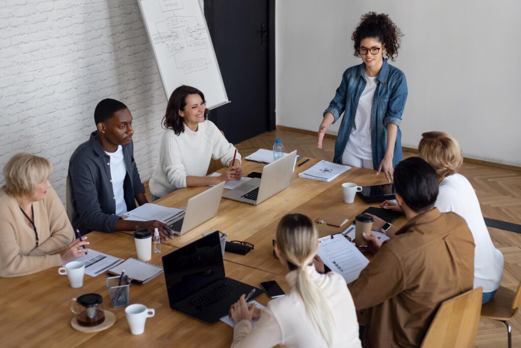 7 business people in a meeting