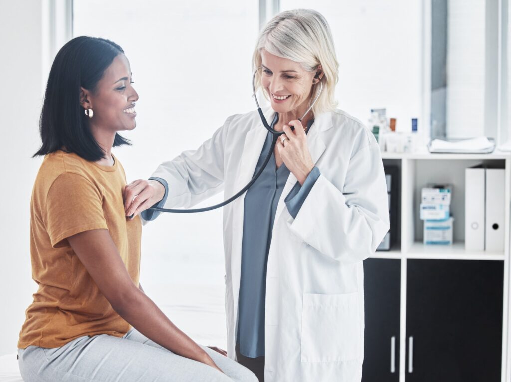 Physician checking patient heart rate
